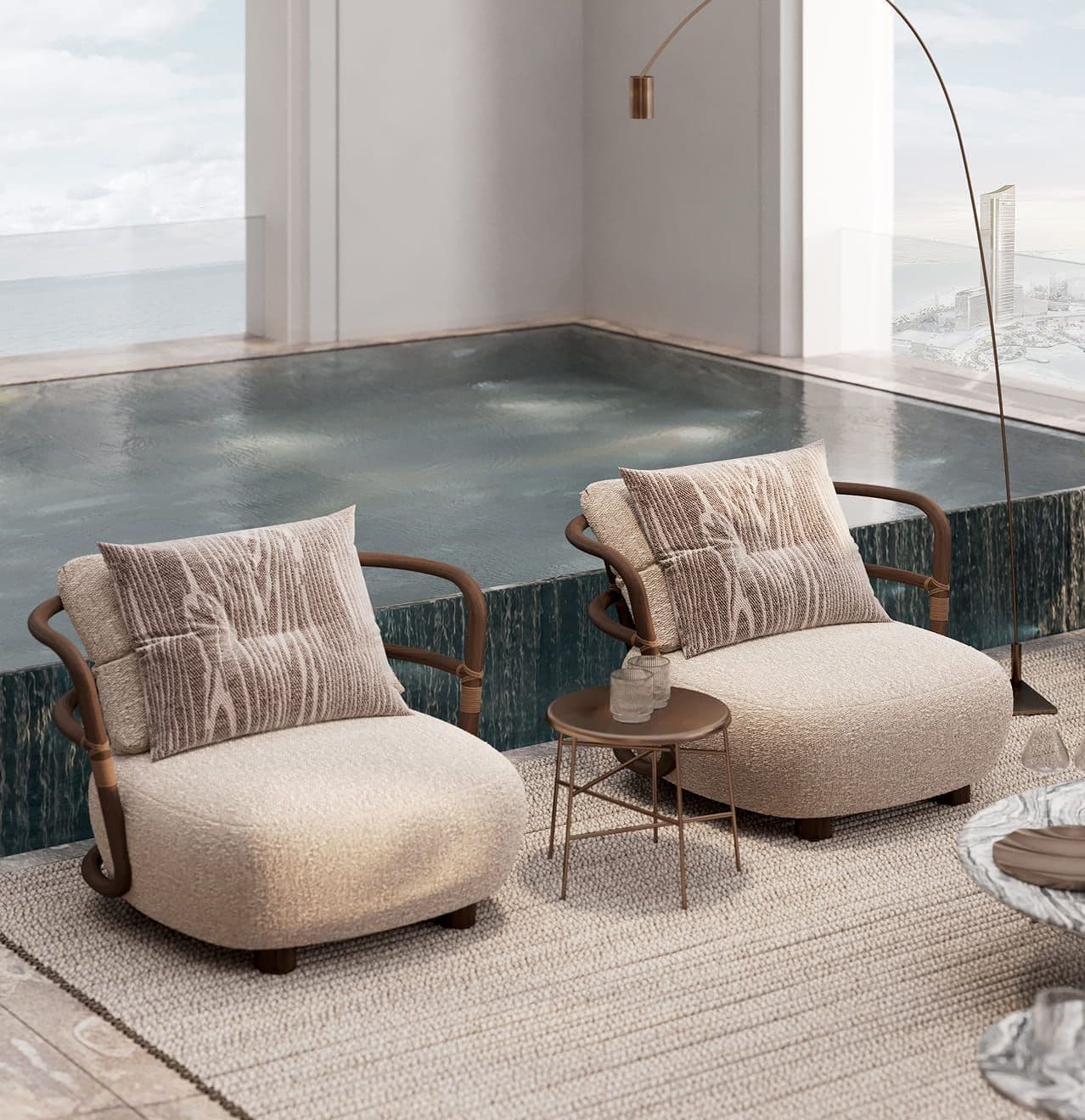 Two modern cream armchairs sit beside a sleek indoor pool with a view.